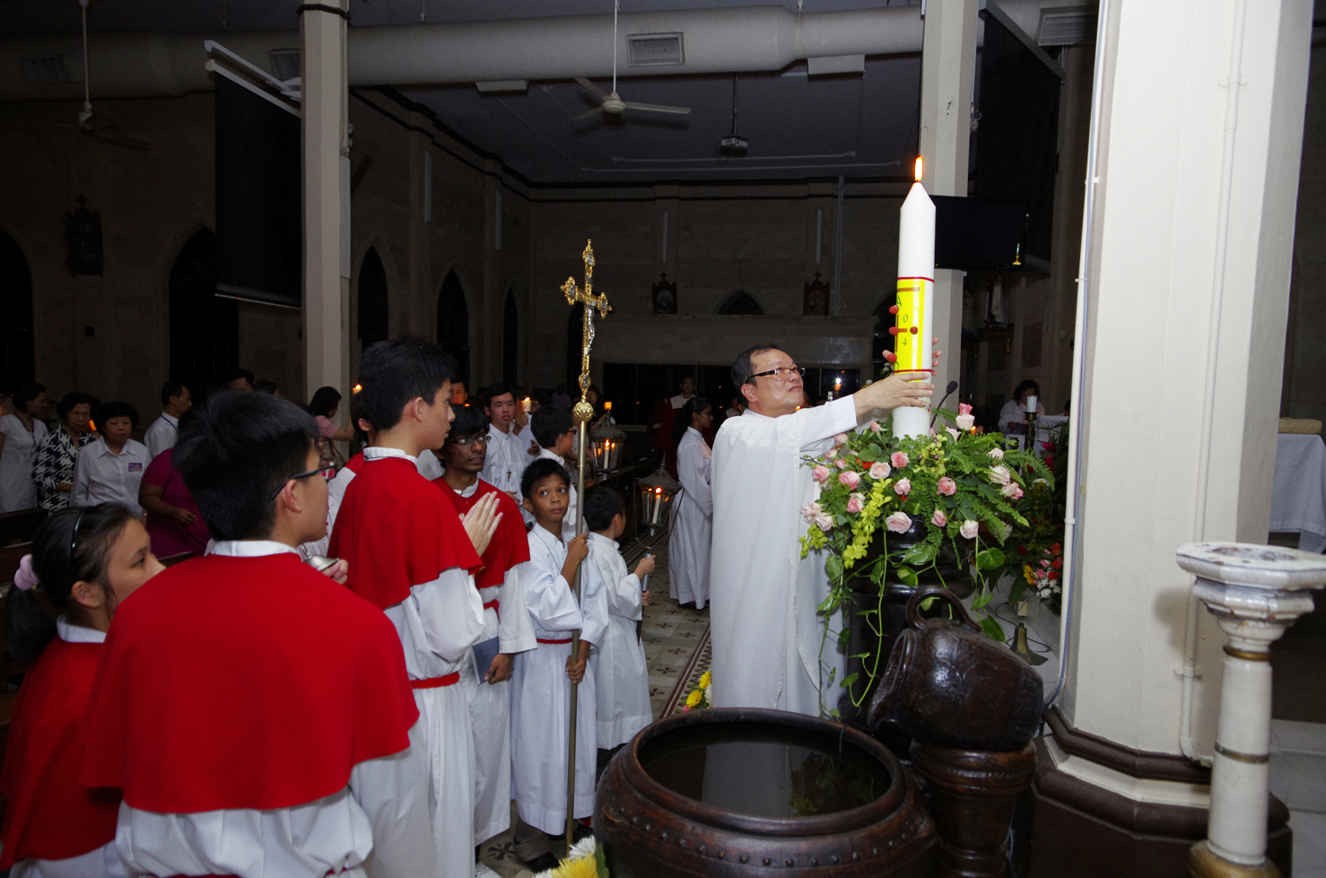 Fr Liew and Easter candle
